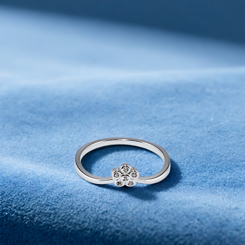 silver ring with a floral design