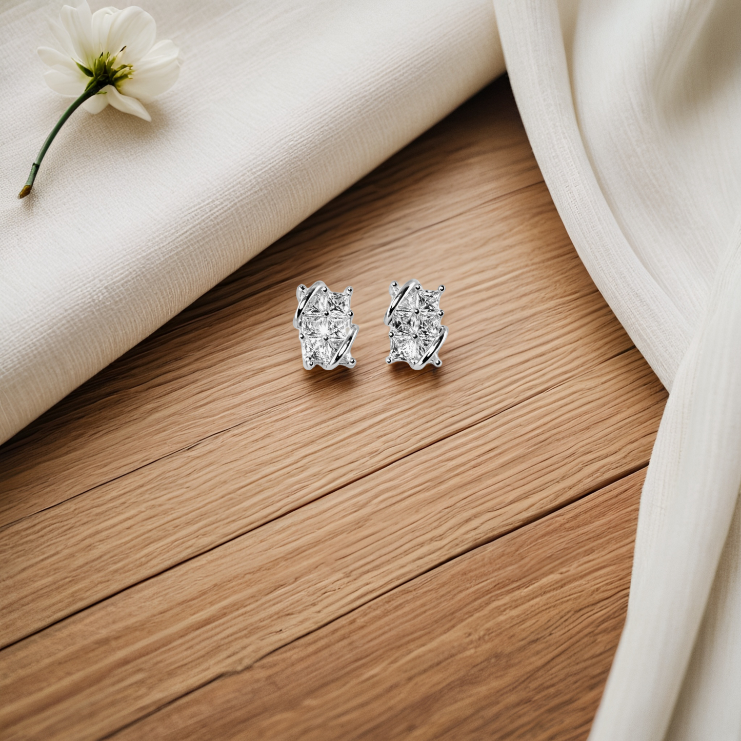 pair of diamond stud earrings in silver