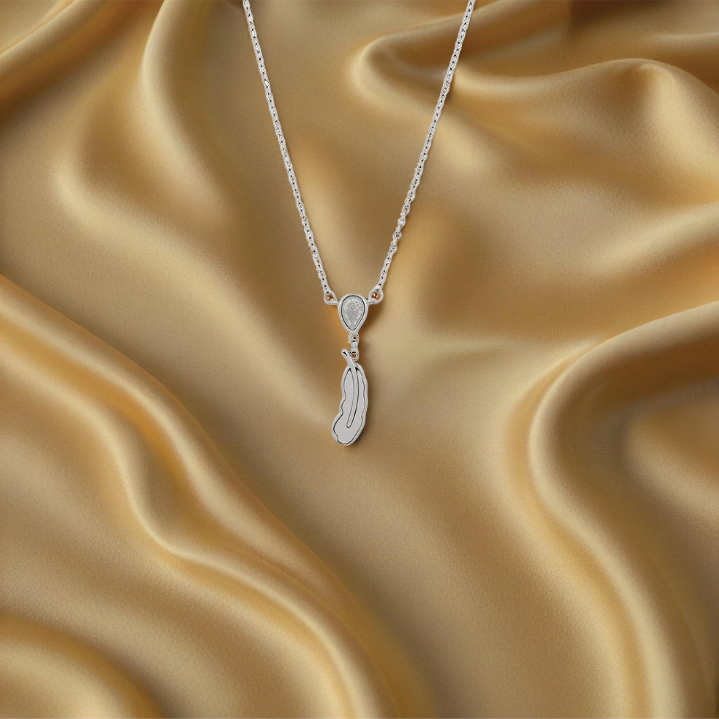 luma feather pendant – sterling silver – rubicstone