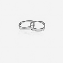 A  silver Couple ring stacked on a white background