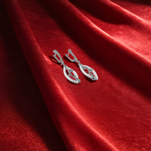 Pair of silver earrings in leaf design