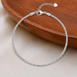 Classic silver charmed anklet in silver