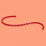Silver Pearl Thread Rakhi – Elegant Festive Charm