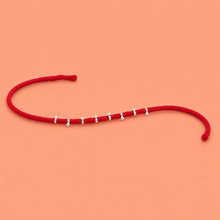 Silver Pearl Thread Rakhi – Elegant Festive Charm