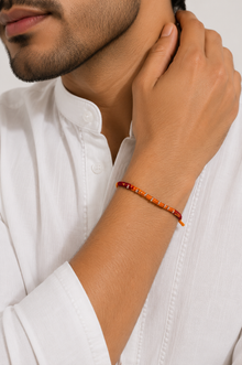 Saffron Weave Silver Bead Rakhi