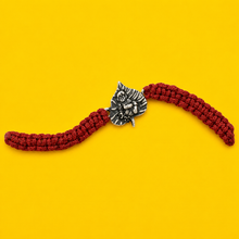 Divine Krishna Leaf Silver Rakhi with Red Thread