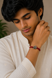 Divine Krishna Leaf Silver Rakhi with Red Thread