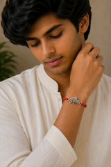 Shri Krishna Silver Rakhi with Braided Red Thread