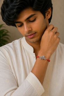 Shri Krishna Silver Rakhi with Braided Red Thread