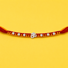 Silver Om Charm Rakhi with Floral Beads Thread