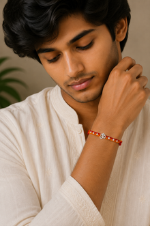 Silver Om Charm Rakhi with Floral Beads Thread