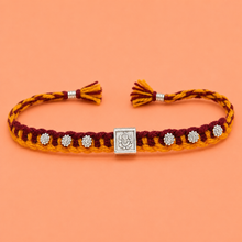 Divine Ganesha Silver Rakhi with Handwoven Thread