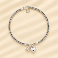 Heart charm women`s anklet in silver