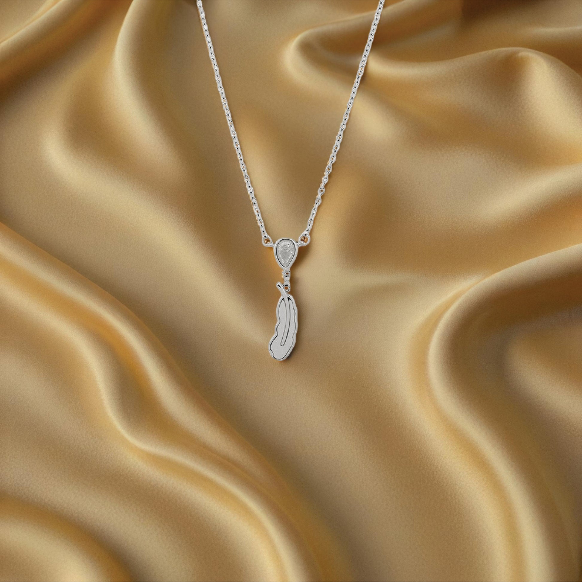 Luma Feather Pendant – Sterling Silver – Rubicstone