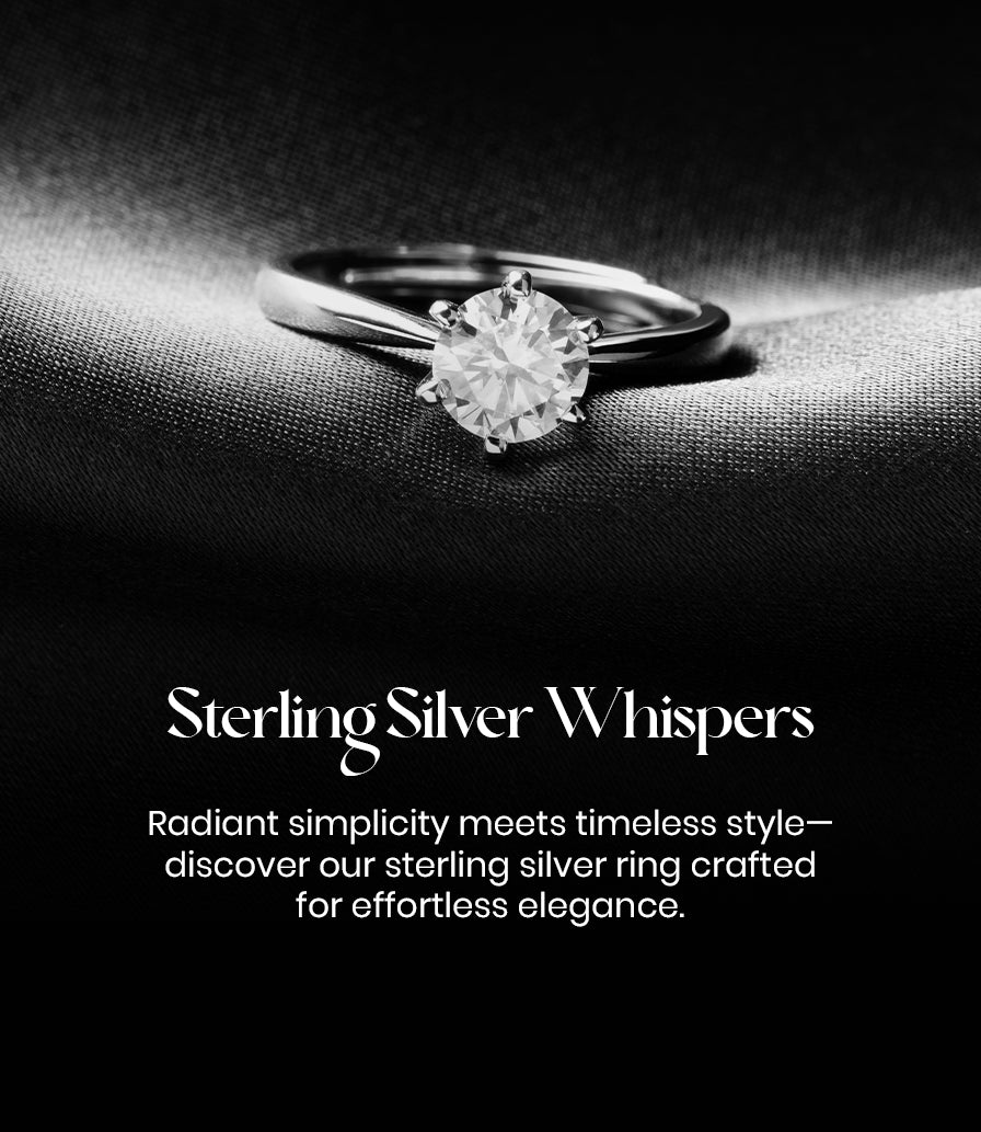 Silver ring on a dark fabric background with 'Sterling Silver Whispers' text.