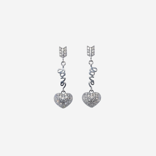 Pair of silver heart-shaped earrings with 'LOVE' inscription on a white background
